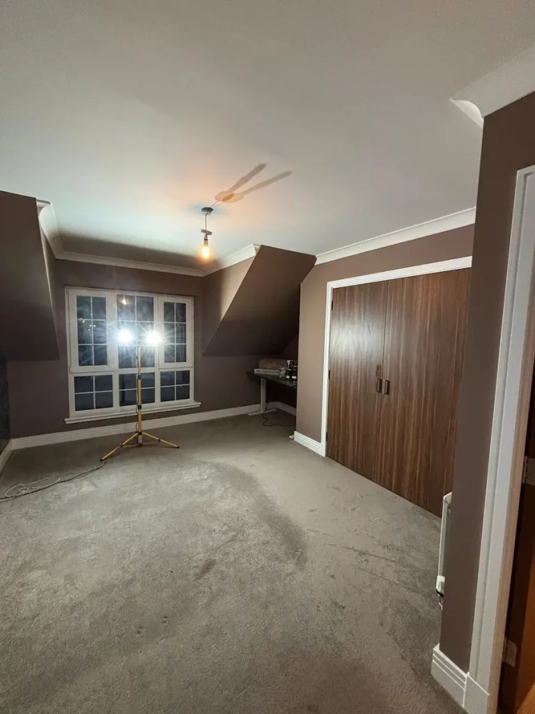 Empty room with painted walls & new coving